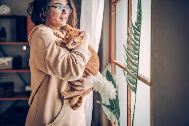 istock Carefree woman with cat 937808828