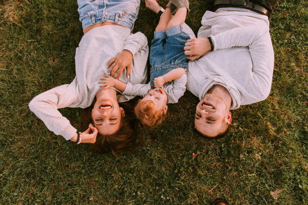 istock Young family spending time together in green nature. 937809412