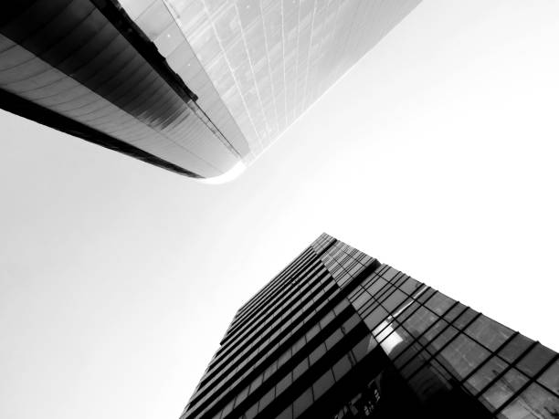 istock Black and white low angle view of two skyscrapers 937813046