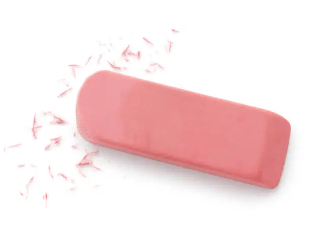 Used pink eraser isolated on white