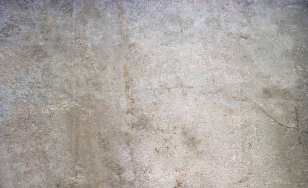 istock Concrete wall background. The background is interesting with texture, toned patches, natural cracks. 937822178