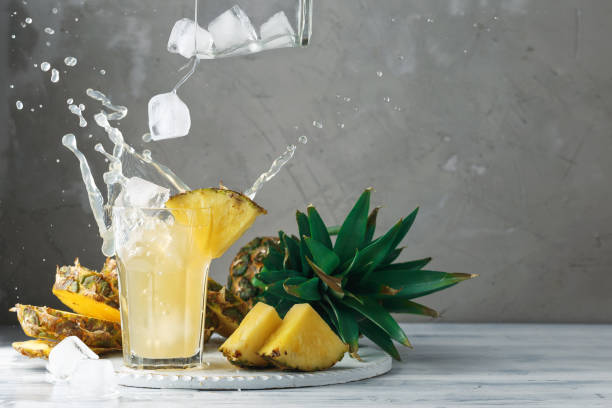 istock Pineapple and ice with splash on wood 937823000