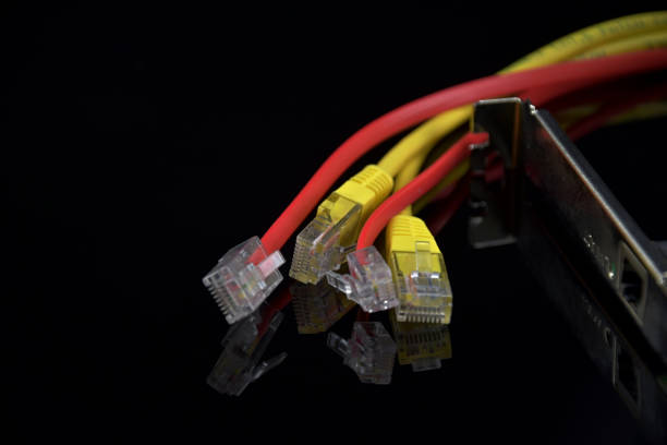 istock Internet Access. Wires for internet connection on a black background. Reflection in black glass. Network card. 937829318