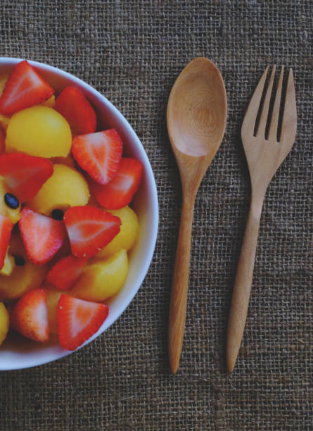 strawberry and watermelon with wood spoon.