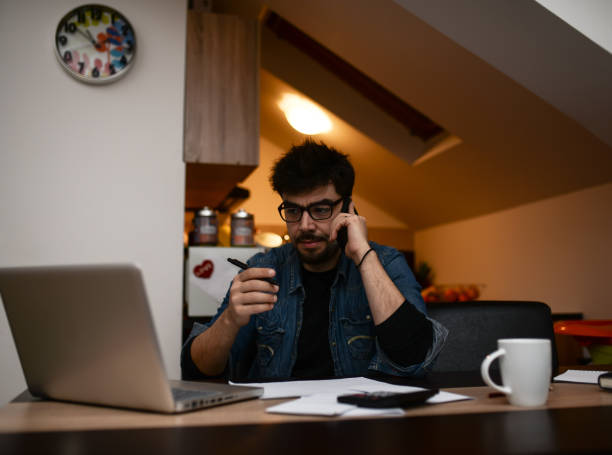 istock Young single dad working overtime because of financial problems 937836942