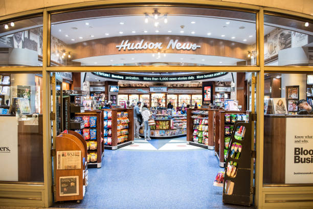 Grand central terminal subway in New York City with sign, people walking inside Hudson Group news store shop New York, USA - October 29, 2017: Grand central terminal subway in New York City with sign, people walking inside Hudson Group news store shop hudson stock pictures, royalty-free photos & images