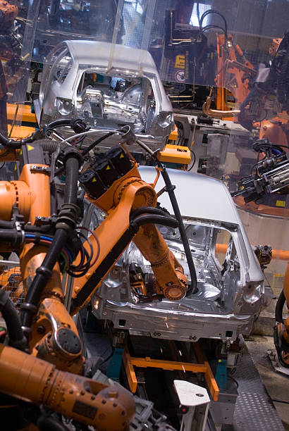 robot azione - automobile industry transportation indoors vertical foto e immagini stock