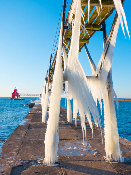 Sturgeon Bay Pierhead Lighthouse looking tiny by huge icicles