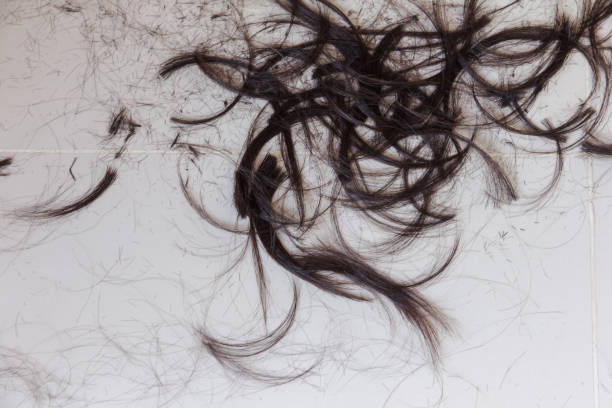 istock hair scrapped on floor after cutting 937840426