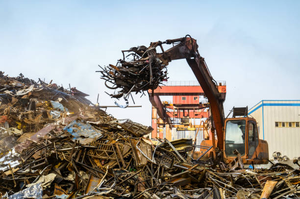 istock Grab crane works in waste recycling station 937862170