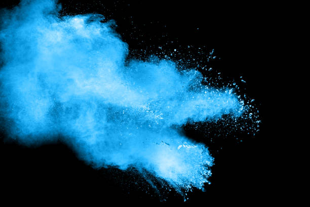 istock abstract blue dust explosion on  black background ,abstract blue powder splattered on black background , Freeze motion of blue powder exploding. 937862422