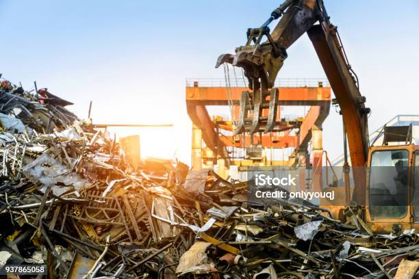 Grab Crane Works In Waste Recycling Station Stock Photo - Download Image Now - Scrap Metal, Recycling, Metal