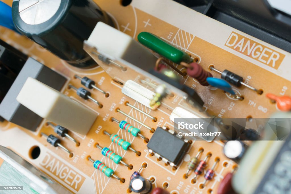 board with radio components board with radio components - transitor, diode, capacitor, microcircuit, transformer, coil inside the VCR Backgrounds Stock Photo