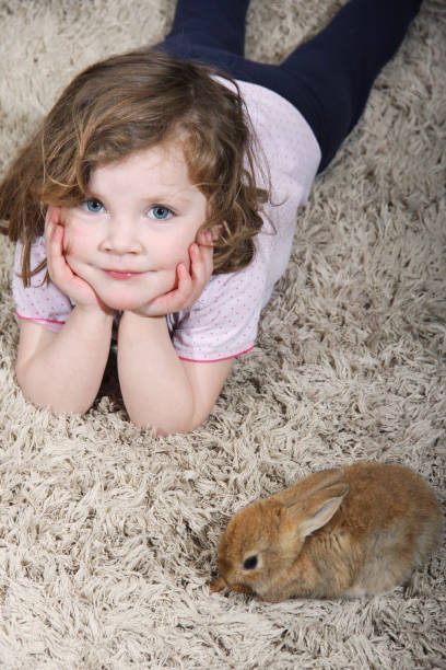 istock girl and bunny 937877998