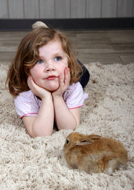 istock Angelic girl with little bunny 937878144