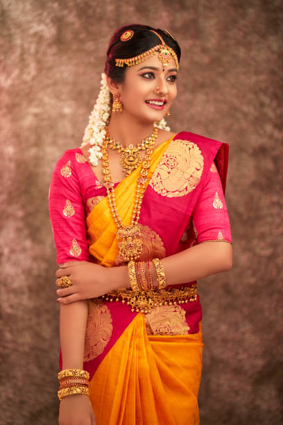 istock Beautiful smiling Indian bride with jewelry 937881750