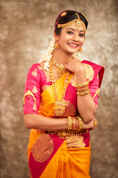 istock Beautiful smiling Indian bride with jewelry 937881796
