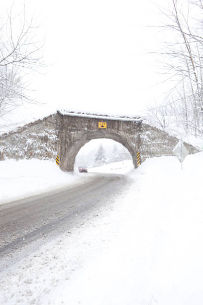istock Driving on a Small Country Road During a Snowstorm 937881900