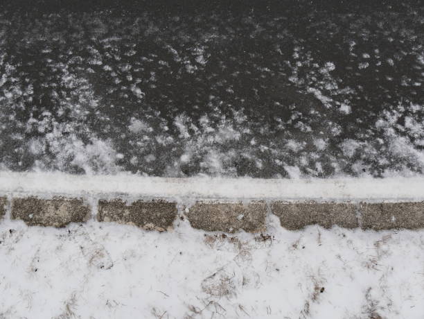 istock Snow and ice street texture 937887700