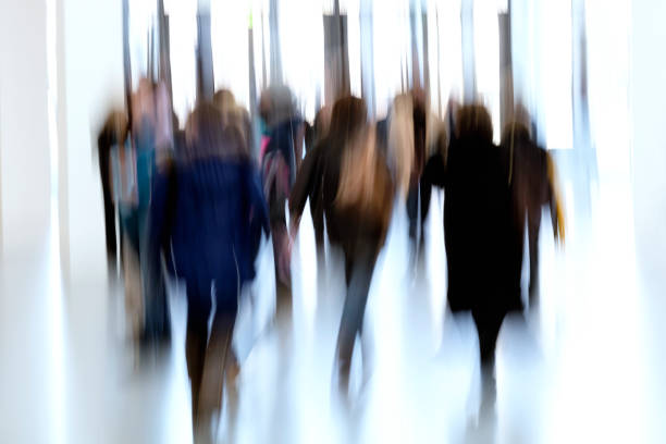 istock Silhouettes of people in a modern interior 937890892