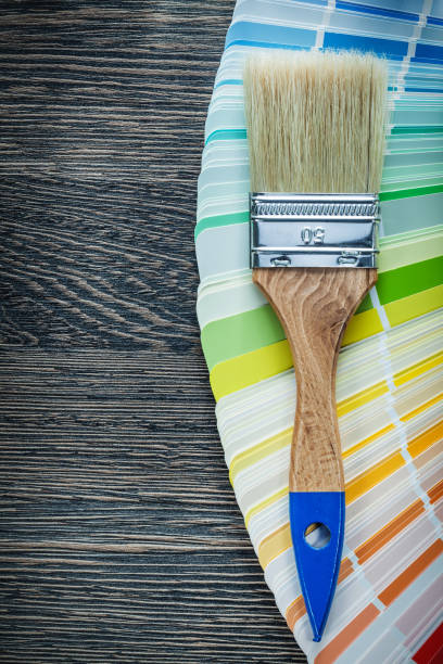 istock Paintbrushes color pantone fan on wooden board 937891022