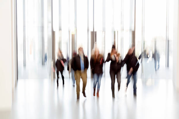 istock Silhouettes of people in a modern interior 937891044