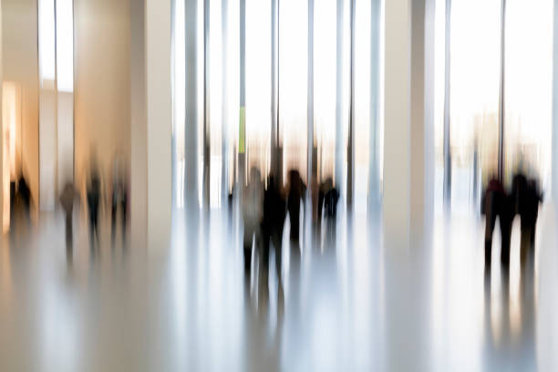 istock Silhouettes of people in a modern interior 937891240