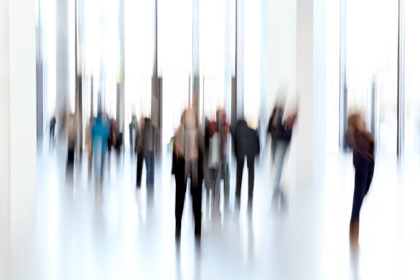 istock Silhouettes of people in a modern interior 937891358