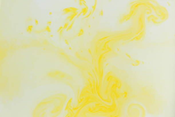 istock Abstract yellow background, pastel pattern, yellow paint in white liquid, stains on milk, art, minimalistic background, blank for designer, pop art, creative layout 937891360