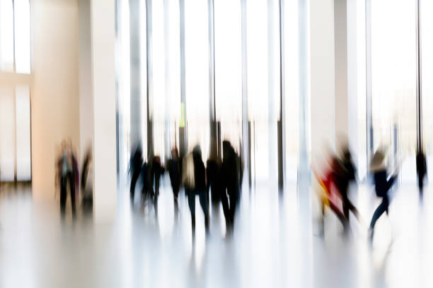 istock Silhouettes of people in a modern interior 937891634