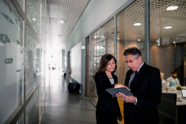 istock Business people standing and talking. 937895388
