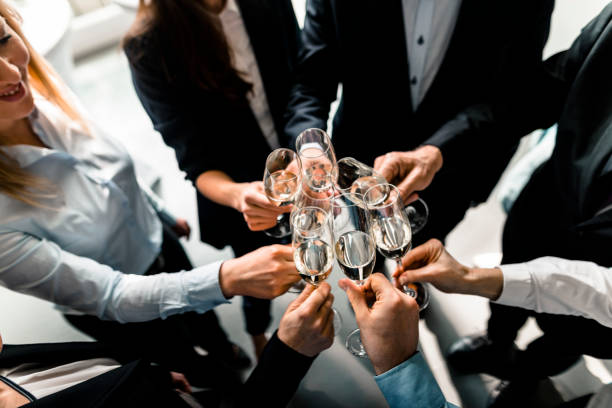 toasting to success - party business toast champagne imagens e fotografias de stock