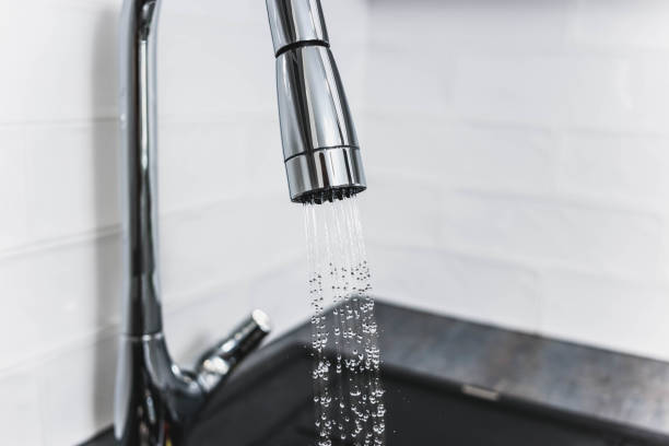 istock modern chrome-plated kitchen faucet in shower 937896254
