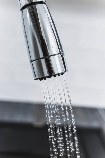 istock modern chrome-plated kitchen faucet in shower 937896258