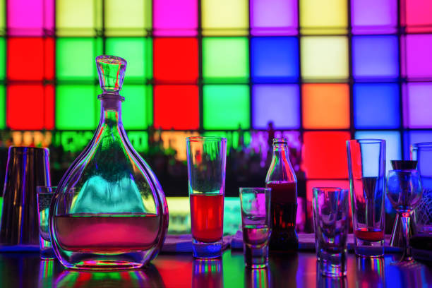 Glass dishes in color lights background