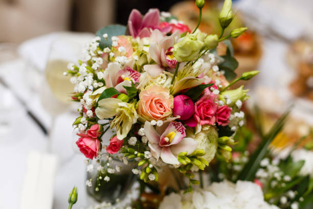 istock elegant wedding bouquet on table at restaurant 937907494