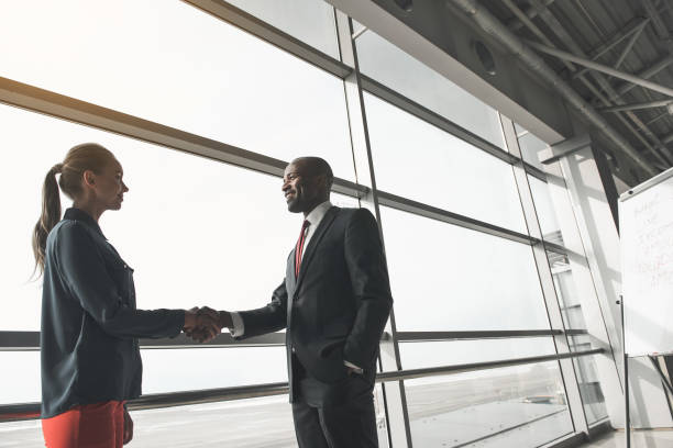 istock Happy employee greeting his colleague 937917442
