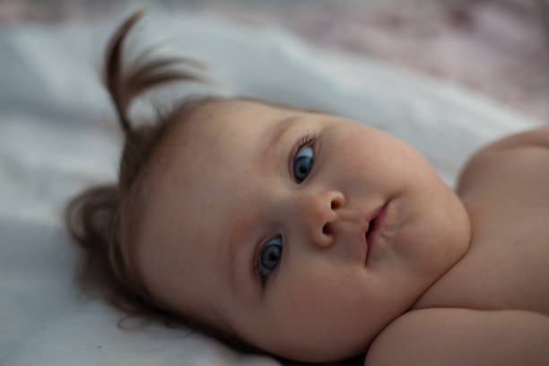 istock Baby looking at the camera. 937917586