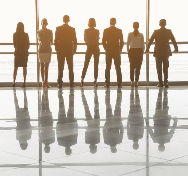istock Team of employees waiting for conference in hall 937920268