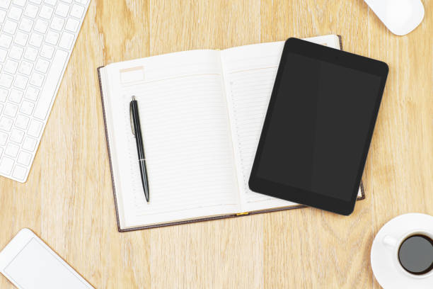 istock Office desktop with tablet and supplies 937923098