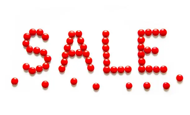 Photo of Red Text sale made of round candy dragee