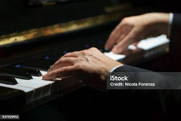 Professional Musician Pianist Hands On Piano Keys Of A Classic Piano In The Dark Stock Photo - Download Image Now