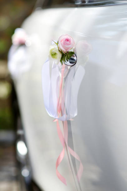 istock Wedding car decorated with pink rose 937933380