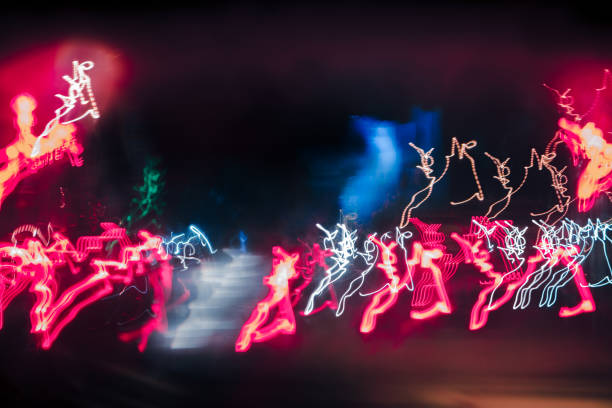 istock abstract background blurred colored marks from fast moving cars night 937936638