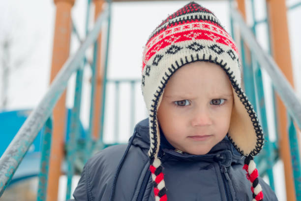 istock the boy poses with a winter cap 937939372