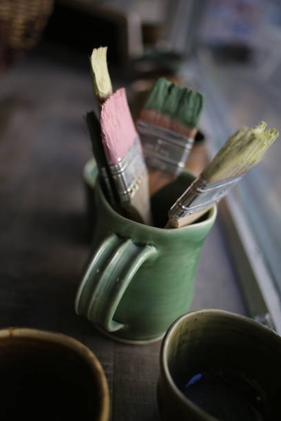 istock Dirty Paint Brushes in a Mug 937942742