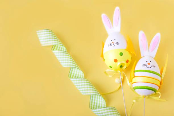 istock Easter eggs with bunny ribbons and candies 937945572