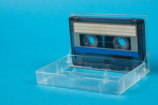 istock Blank cassette tape box with retro cassette on blue background 937953314