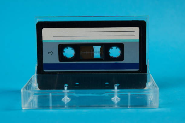 istock Blank cassette tape box with retro cassette on blue background 937953386