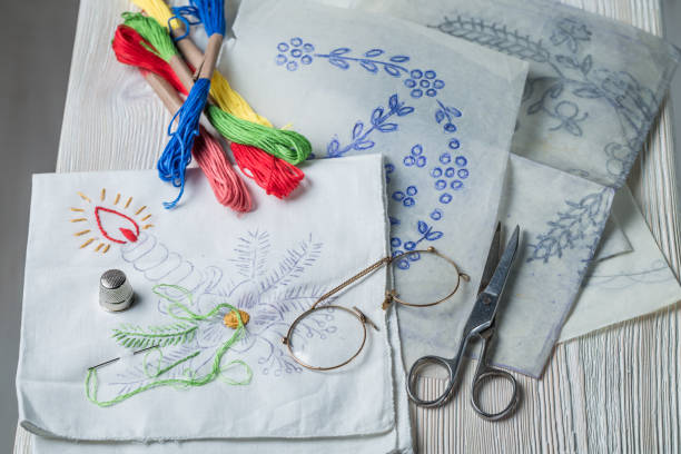 istock Embroidered napkins, color mulina and paper model 937960062